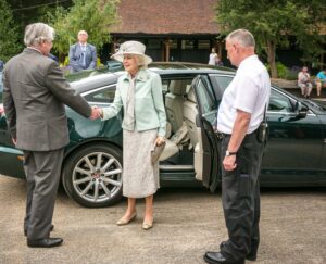 Princess Alexandra being greeted by the Lord-Lieutenant on arrival at Leeds Castle. c) Leeds Castle.