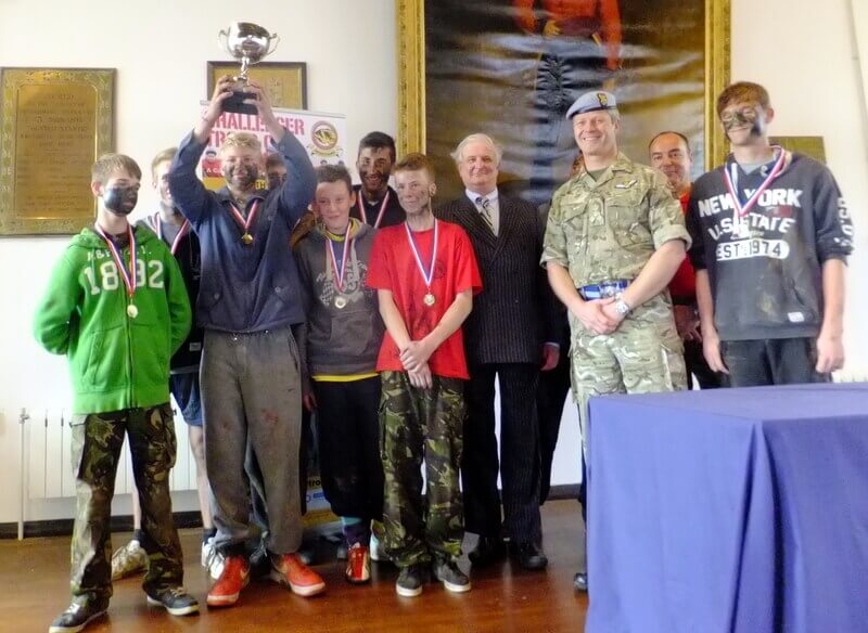 Viscount De L'Isle with Brigadier C J Clayton MBE MA Commander 2 (South East) Brigade and the winning team from The North School, Ashford, Kent
