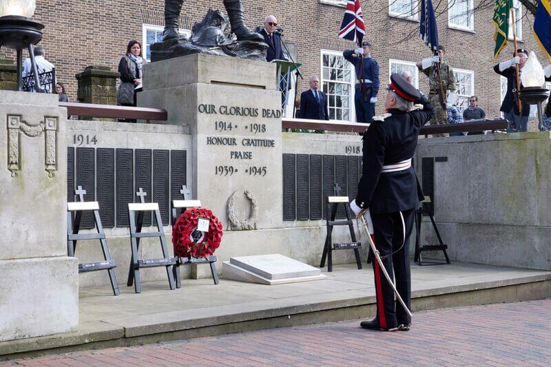 The Lord-Lieutenant of Kent taking the salute after laying a wreath by the unveiled paver to Major Dougall VC MC. (c) David Bartholemew.