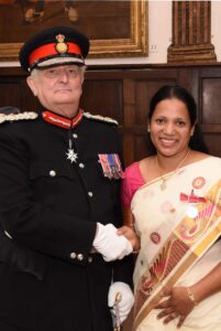 Dr Agimol Pradeep being congratulated by the Lord-Lieutenant. (c) Barry Duffield DL.