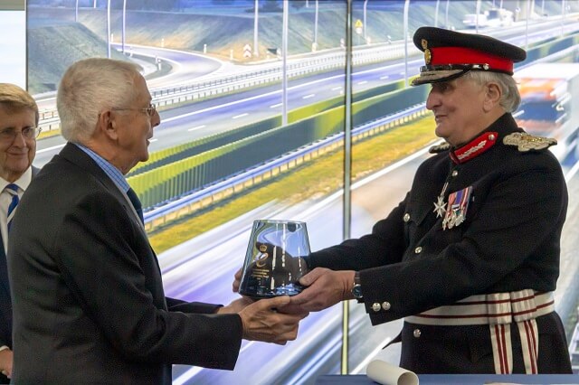 Brigade Electronics Founder and Chairman Chris Hanson-Abbott OBE receives the Queen's Award for Enterprise from the Lord-Lieutenant, Viscount De L’Isle CVO MBE. Far left is Douglas Horner DL who read the citation. (c) Victoria Collins.